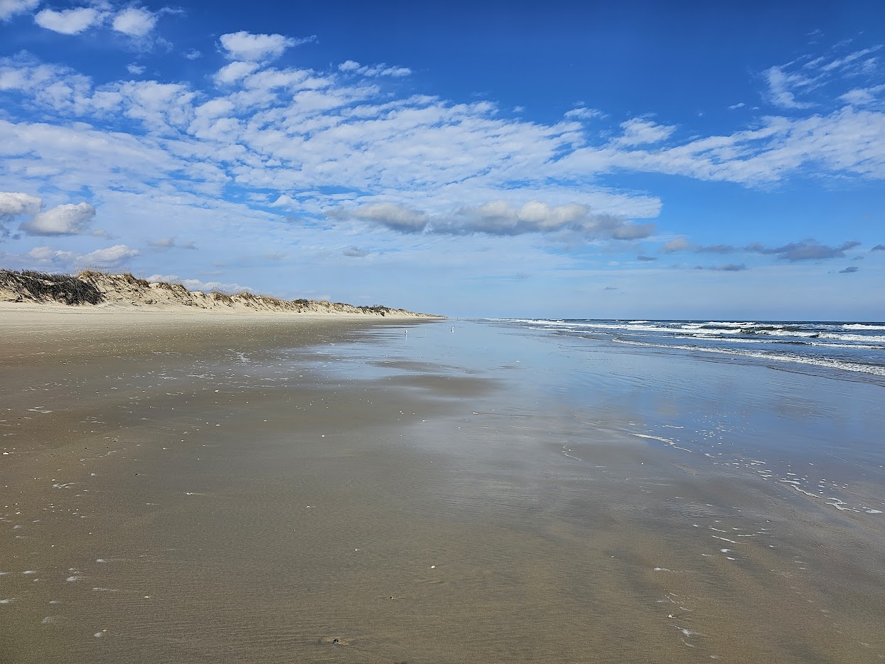 Pristine north end beach with dunes and blue sky